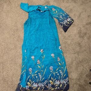 Rosey-T long, sleeveless, blue dress with scarf.